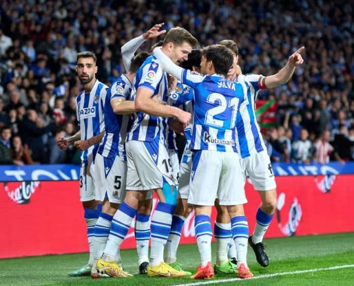 sociedad_dan_sevilla_amankan_tiket_16_besar