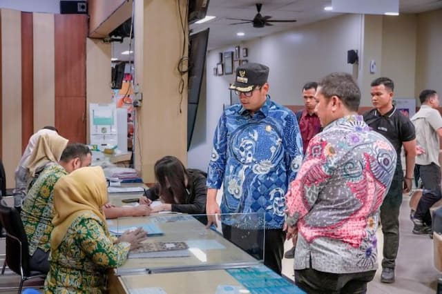 pemko_medan_permudah_pengurusan_dokumen_warga_terdampak_banjir