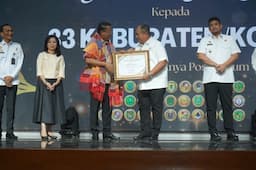 bupati_asahan_terima_penghargaan_menteri_hukum_atas_dukungan_program_bantuan_hukum