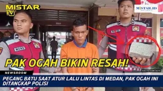 newsroom_pegang_batu_saat_atur_lalu_lintas_di_medan_pak_ogah_ini_ditangkap_polisi
