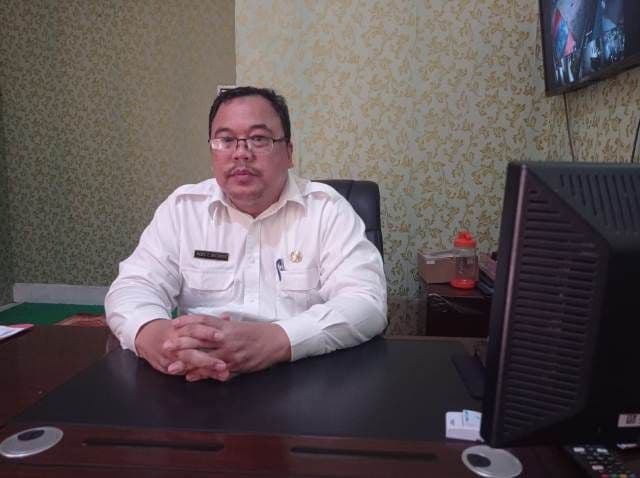 rp100_juta_dlh_siantar_lunasi_tunggakan_pajak_kendaraan_dinas