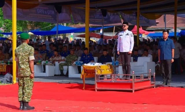 pemkab_labusel_gelar_upacara_penaikan_bendera_lptq_dan_lasqi_2026_ribuan_warga_hadir