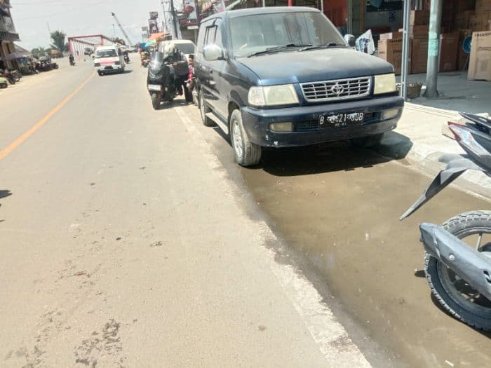 warga_porsea_kecewa_pembangunan_jalan_yang_baru_dibangun_tergenang_air