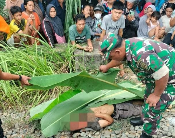 asal_menyeberang_pria_berkaos_hitam_tewas_terseret_kereta_api_di_lubuk_pakam