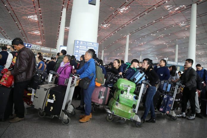 china_longgarkan_pembatasan_penerbangan_internasional_mulai_8_januari