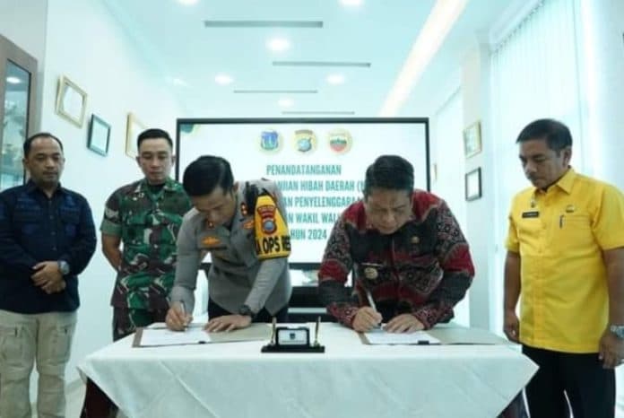 pemko_tebing_tinggi_teken_nphd_pengamanan_pilkada_2024