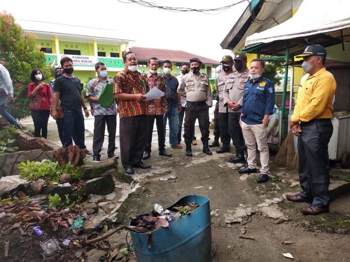 polres_tebing_tinggi_kawal_proses_sita_eksekusi_di_kompleks_sekolah_al_washliyah