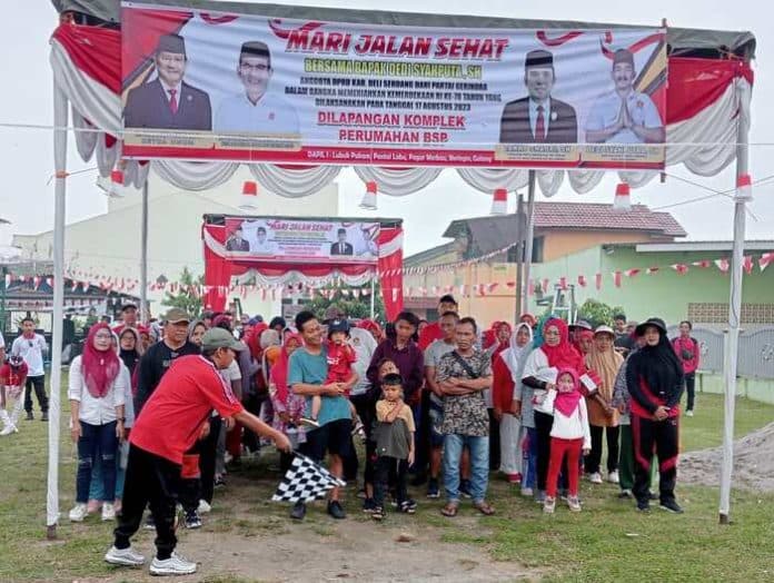 sempat_hujan_jalan_sehat_tetap_warnai_kemeriahan_hut_ri_ke_78_di_deli_serdang