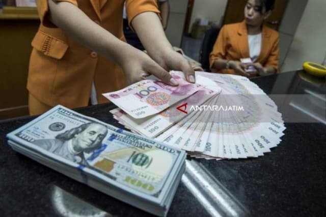 yuan_china_menguat_99_poin_jadi_70690_terhadap_dolar_as