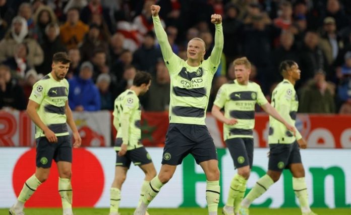 Penyerang Manchester City Erling Haaland melakukan selebarsi usai mencetak gol di Liga Champions. (Photo by Odd ANDERSEN / AFP) (AFP/ODD ANDERSEN).