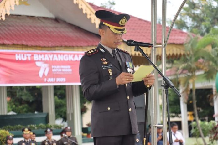 Kapolres Tebing Tinggi, AKBP Andreas Luhut Jaya Tampubolon, S.I.K, M.K.P., saat mebacakan pidato Presiden RI, Jokowi Dodo (f:ist/mistar)