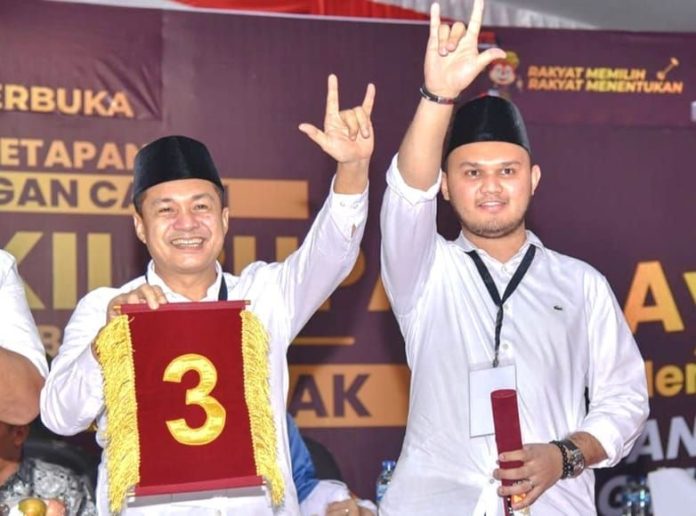 Mantan Bupati Batu Bara, Zahir (kiri), saat menghadiri pencabutan nomor urut Cabup Batu Bara