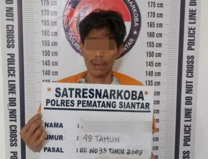 Pelaku yang diamankan polisi.