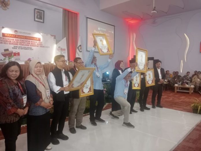 Ketiga paslon Bupati dan Wakil Bupati Deli Serdang saat pencabutan nomor paslon oleh KPU di Wing's Hotel Kualanamu.