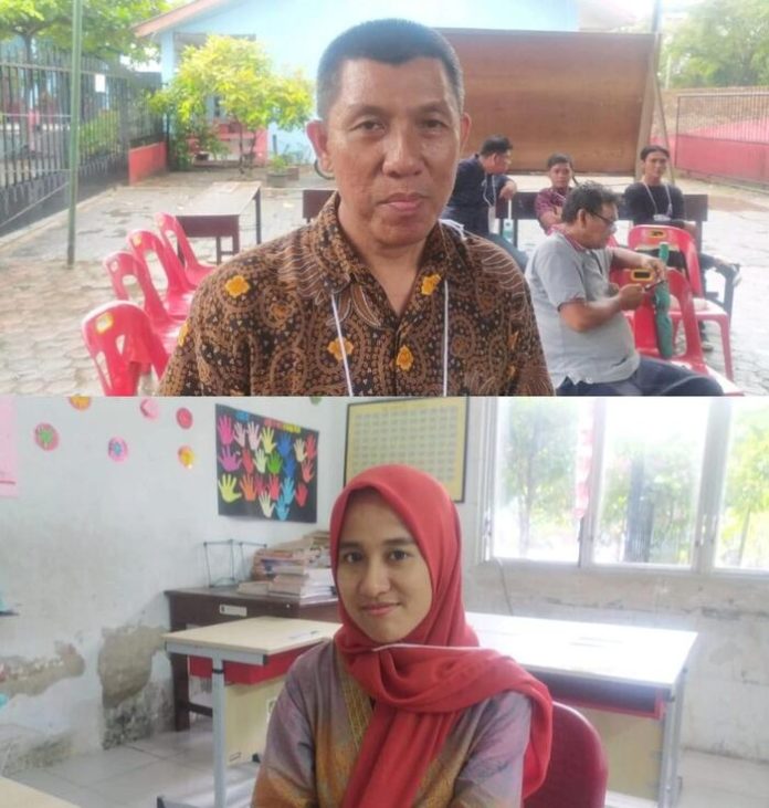 Ketua KPPS 13, Harjosari I, Medan Amplas, Syahril dan anggota KPPS Fatiha Augri (f:susan/mistar)